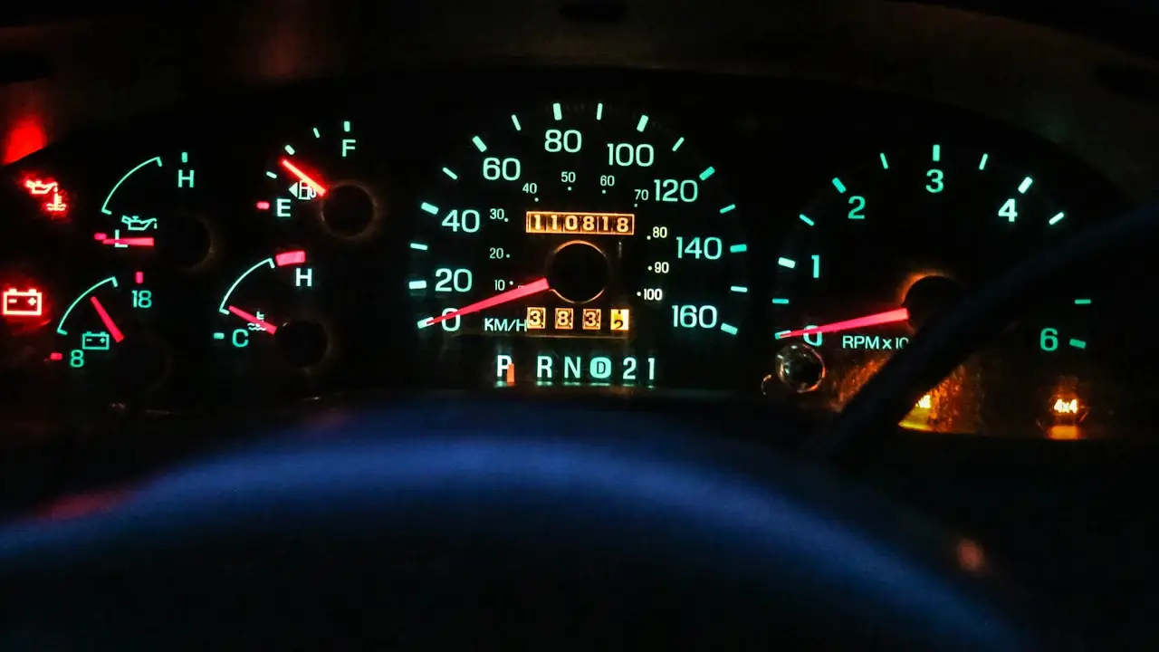 A pickup’s lit instrument cluster with the odometer, speedometer and gear indicator.