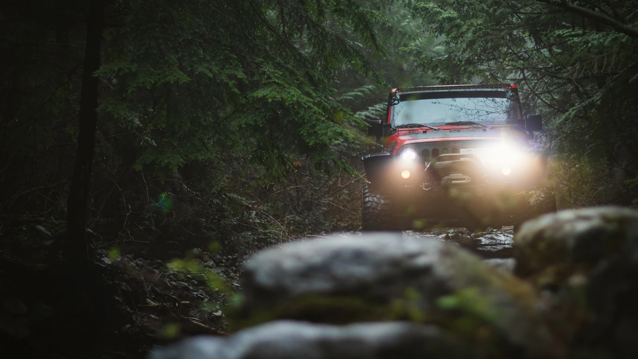 black vehicle on dirt road