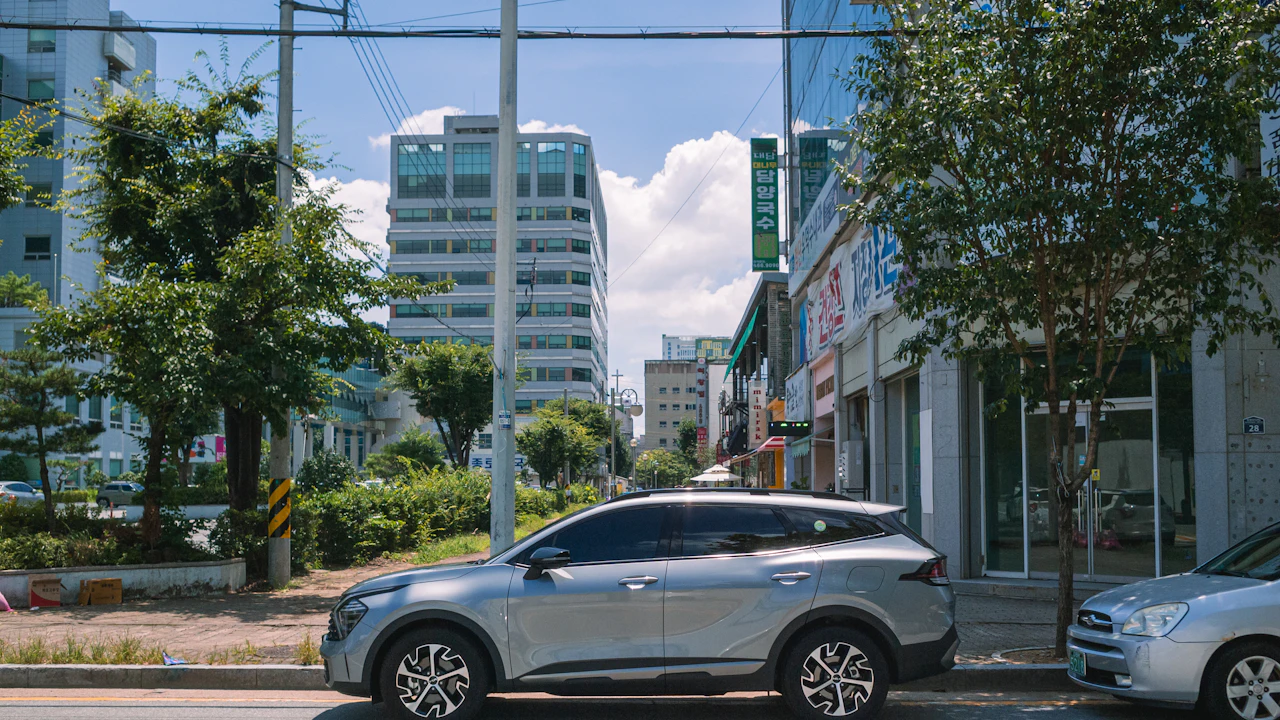 Silver suv parked on a city street