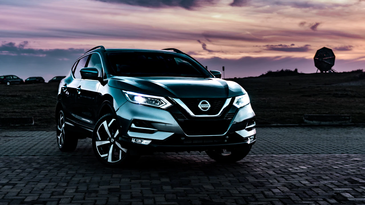 gray Nissan Rogue SUV outdoor during nighttime