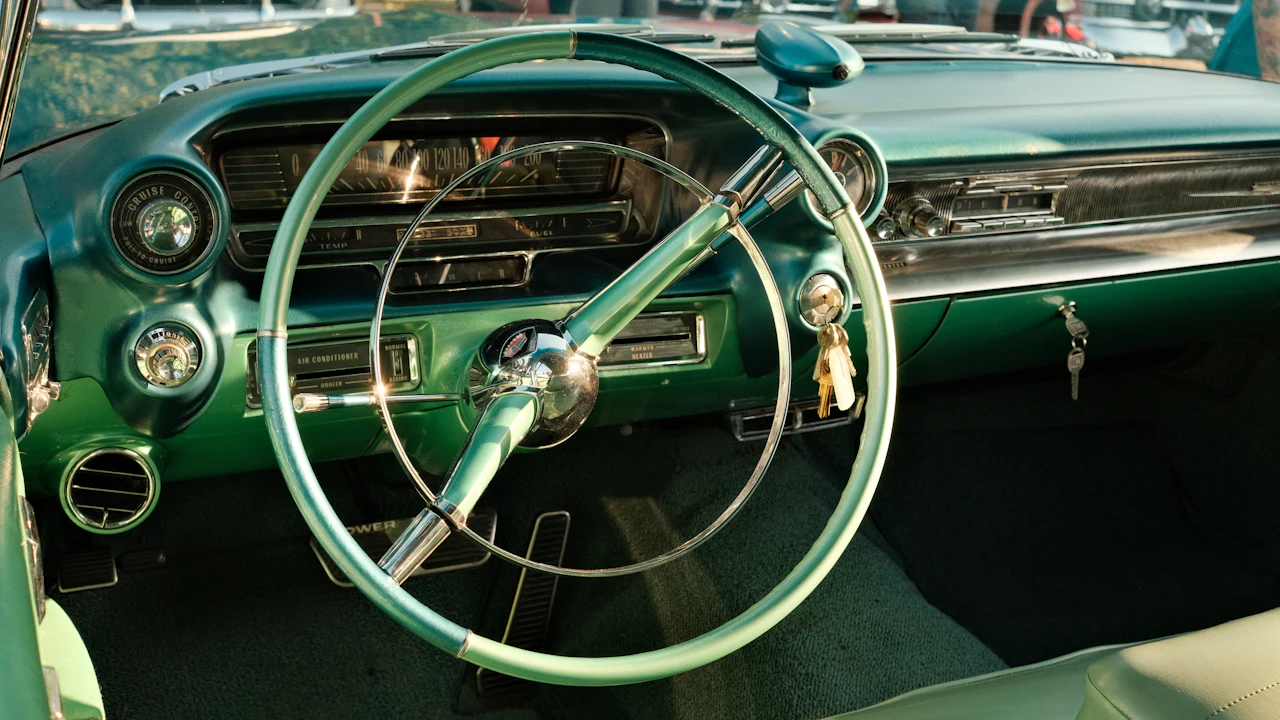 A car's steering wheel and the column connecting it to the dashboard