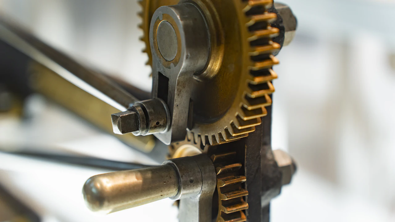 A rack-and-pinion mechanism, a pinion gear meshing with a toothed rack