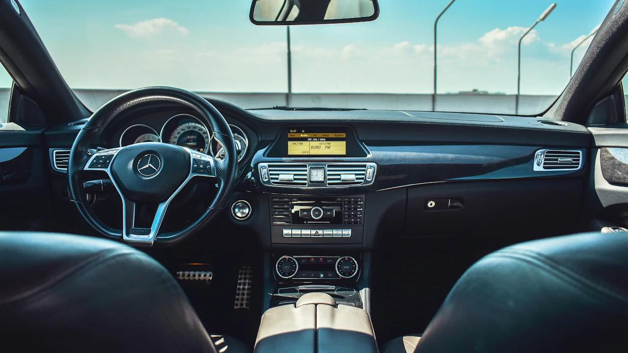 black Mercedes-Benz vehicle steering wheel