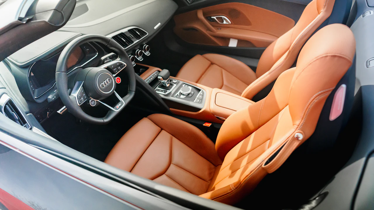 Leather seating and trim detail inside a car cabin