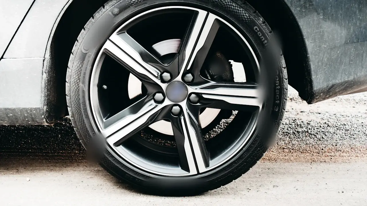 A low-profile tire on a five-spoke alloy wheel.
